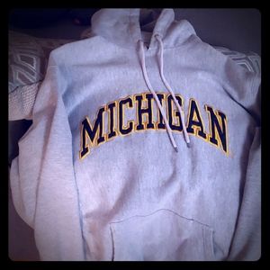A size large  MICHIGAN UNIVERSITY hoodie.